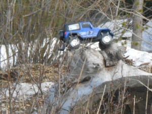 One of my grandsons' toy cars (or is that jeep?). As soon as the snow starts to melt, the kids start dragging toys outside. 